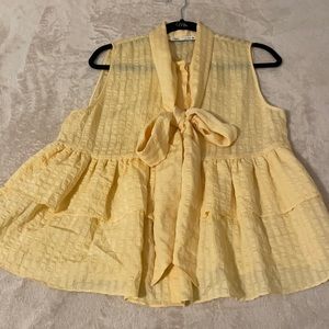 Yellow button down shirt